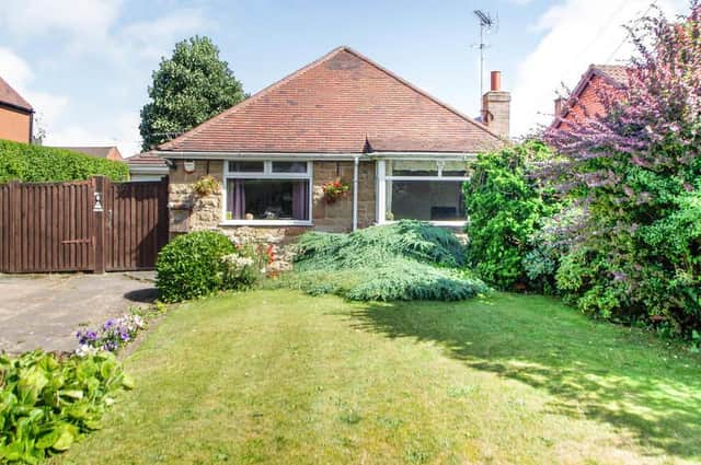 The bungalow on Big Barn Lane in Mansfield sits in a lovely setting. The colourful front garden adds to its appeal.