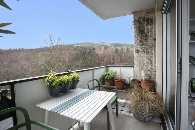 The property's long balcony with space for seating, offering great views of Arthur's Seat and beyond.