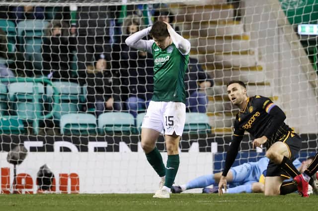 Kevin Nisbet has his head in his hands after missing a late chance for Hibs. Picture: SNS
