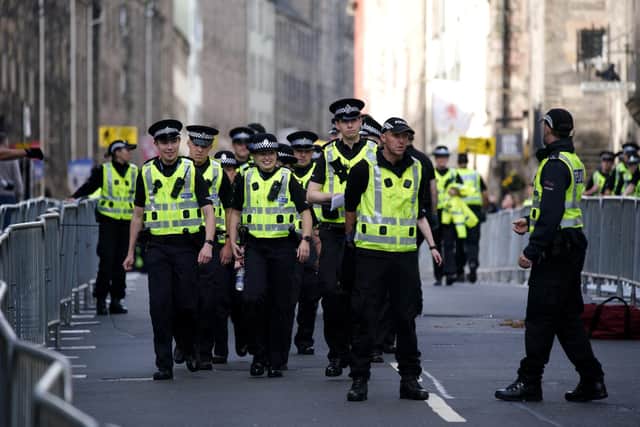 Police officers on the Royal Mile in Edinburgh. Police confirmed the arrest.