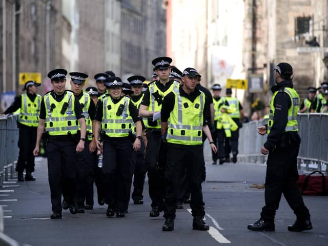 Police officers on the Royal Mile in Edinburgh. Police confirmed the arrest.