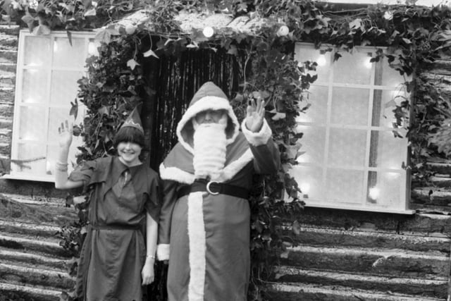 Santa Claus and one of his elf helpers outside his new grotto in Princes Street Gardens in December 1985.