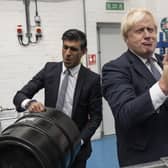 Boris Johnson and Rishi Sunak get the beers in during a visit to Fourpure Brewery in London (Picture: Dan Kitwood/PA)
