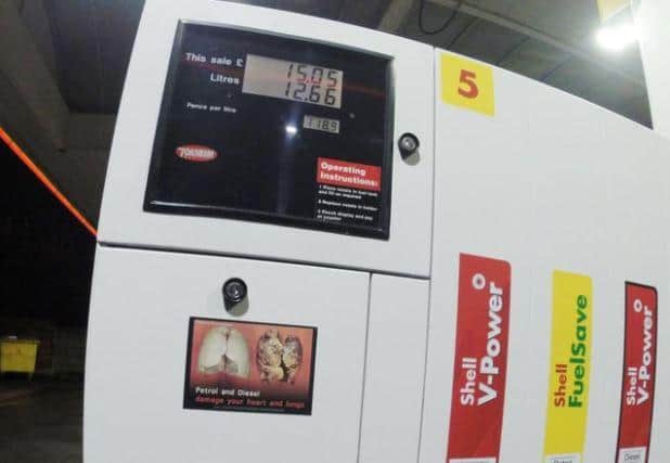 Extinction Rebellion stickers found on petrol pumps in England. Picture: Wigan Today