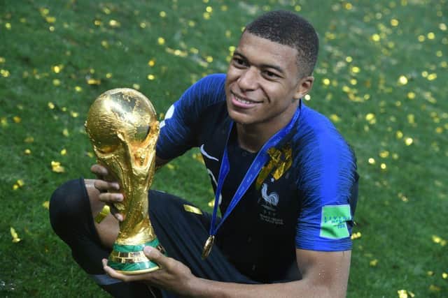 France's forward Kylian Mbappe celebrates with the trophy at the end of the Russia 2018 World Cup final (Photo: KIRILL KUDRYAVTSEV/AFP via Getty Images)