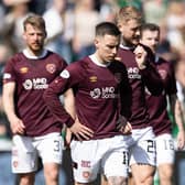 A dejected Hearts squad make their way from the Easter Road turf after losing another game in the cinch Premiership. Picture: SNS