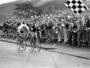 New Zealander Bruce Biddle and Australian Ray Bilney race towards the chequered flag at the finish of the 102 miles cycling road race during the Commonwealth Games in Edinburgh in July 1970. Biddle won the race.