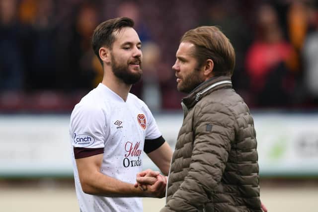 Robbie Neilson congratulates new signing Orestis Kiomourtzoglou at full-time after an accomplished debut performance. Picture: Craig Foy / SNS