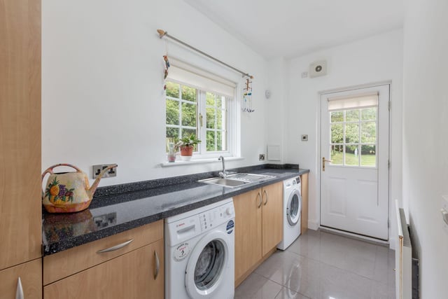 Adjacent to the kitchen is a utility room, which not only adds convenience to your daily routines but also allows direct access to the double garage and the rear garden.