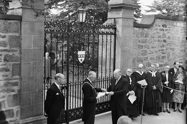 Lord Provost Johnsess-Gilbert receiving keys from Dr T Tiddles to unlock the ceremonial gates as part of the 1959 George Heriot's School 300th anniversary celebrations.