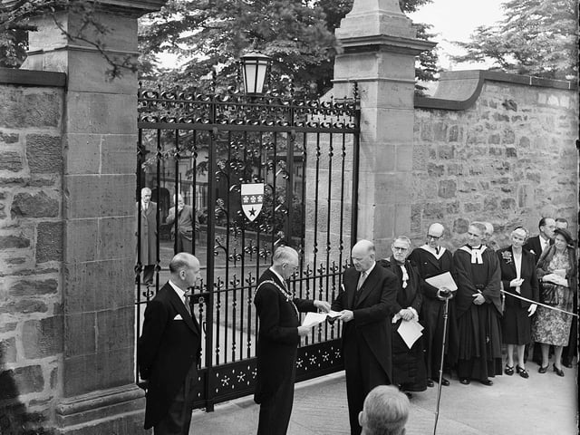 Lord Provost Johnsess-Gilbert receiving keys from Dr T Tiddles to unlock the ceremonial gates as part of the 1959 George Heriot's School 300th anniversary celebrations.