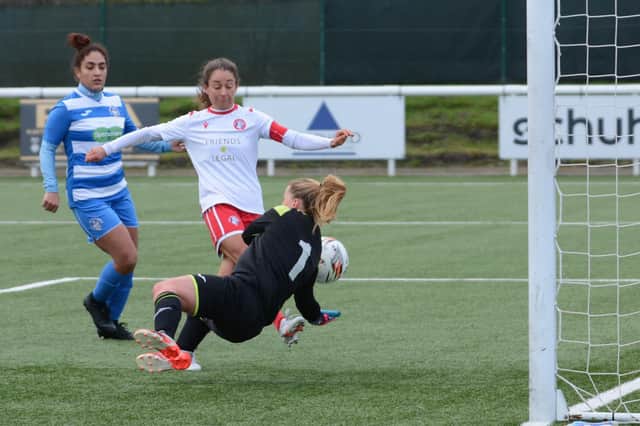 Spartans’ Louise Mason scores one of her two goals on her 200th appearance. Picture: Mark Brown
