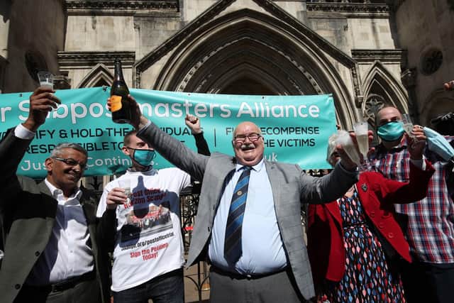 Former Post Office workers celebrate outside the Royal Courts of Justice in London yesterday after 39 people had their convictions overturned. Picture: Yui Mok/PA