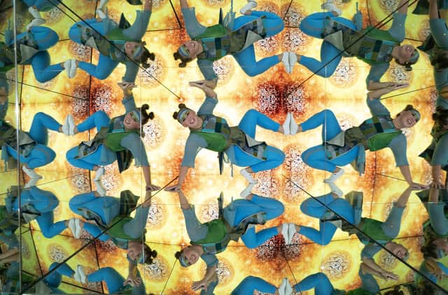 Sophie Douglas, who played an alien from the planet Hanyana in the Edinburgh Fringe show WeCameToDance, explores the giant kaleidoscope at the Camera Obscura & World of Illusions (Picture: Jane Barlow/PA)