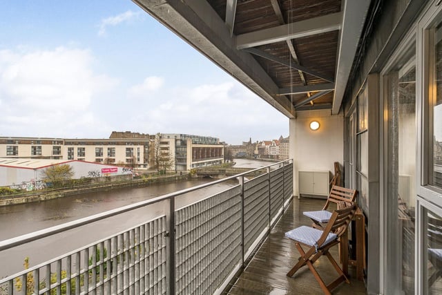 The property's private balcony overlooks the Water of Leith, offering great views of the waterfront.