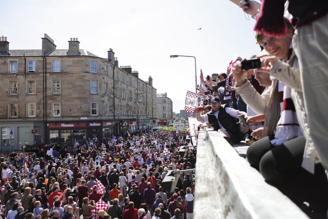 Hearts-fans follow the Scottish Cup 2012 victory parade lead by the bus with the Hearts players on Dalry Road. Picture taken from Dickens bar on Dalry Road.