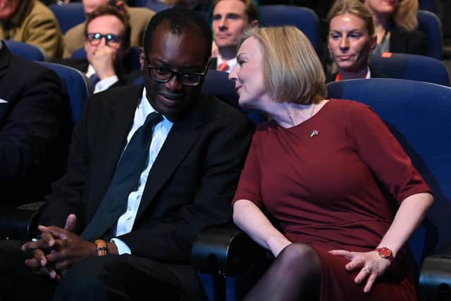 Kwasi Kwarteng and Liz Truss chat at the Conservative Party conference in Birmingham