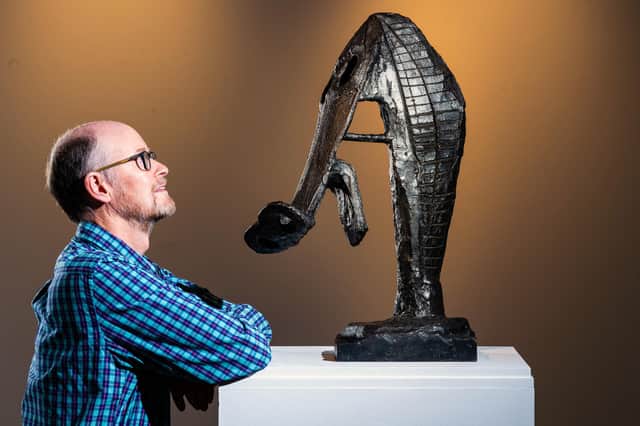 Curator David Patterson with 'Horse's head' Bronze sculpture by Sir Eduardo Paolozzi. Picture: Ian Georgeson.