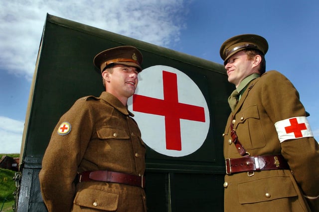 2005. (left to right) William Stuart-Dickey (27) dressed as an Private and as an orderly/stretcher bearer in the RAMC takes some advice from his senior officer (right) Julian Farrance (39) who takes the part of a Lieutenant in the RAMC during The Great War - the re-enactments were part of the weekend demonstrations at Fort Nelson - The Royal Armouries. Picture: Malcolm Wells 052097-89