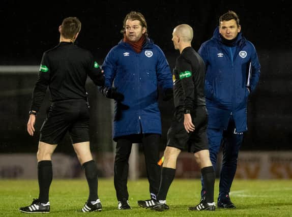 Hearts manager Robbie Neilson spoke with referee Steven McLean at half-time.