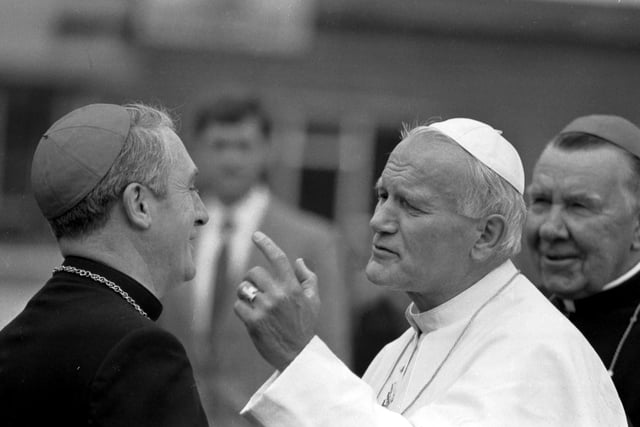 Pope John Paul II is greeted by Archbishop Thomas Winning  and Cardinal Gordon Gray on landing at Turnhouse Airport. Cardinal Winning had played a major role in ensuring the Papal visit went ahead.
