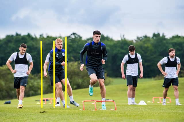Daniel Mackay, centre, trains with his new team-mates including Jack Brydon (second left)