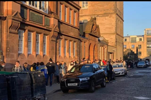 A queue of at least 100 chilly people was pictured waiting outside the centre in Leith.
