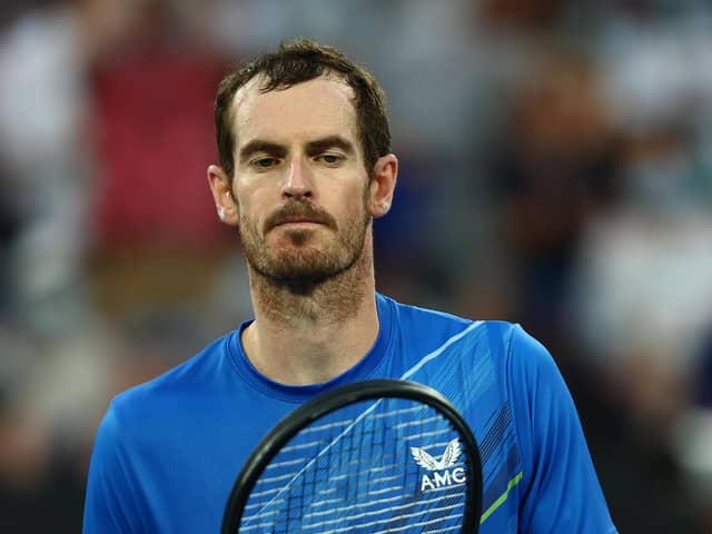 Andy Murray looks dejected after losing his second round singles match against Taro Daniel of Japan during day four of the Australian Open at Melbourne Park