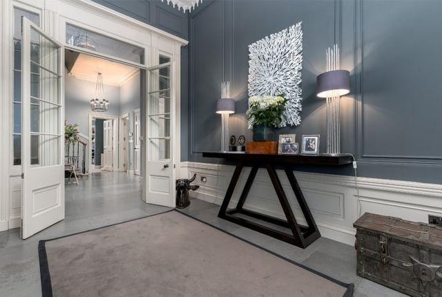The property enters into an amazingly spacious vestibule which leads to a Caithness flagstone floored hallway, with a sweeping spiral staircase