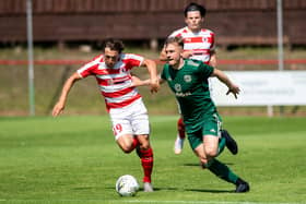 Ross Gray of Bonnyrigg Rose and Brody Patterson in action during the Lowland League match against Celtic B (Photo by Mark Scates / SNS Group)