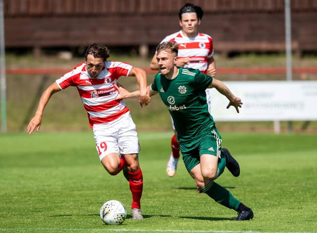 Ross Gray of Bonnyrigg Rose and Brody Patterson in action during the Lowland League match against Celtic B (Photo by Mark Scates / SNS Group)