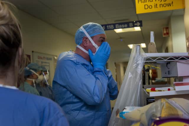 Doctors and nurses prepare to enter the Covid-19 ward at the Edinburgh Royal Infirmary.