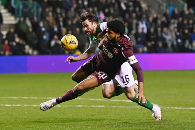 Lewis Stevenson barges down Hearts striker Ellis Simms but no penalty was given. It was a huge moment