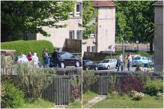 The specialists have been photographed outside a property in Hawkshill Avenue where a man was injured last night (Wednesday, May 13).