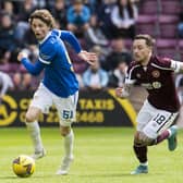 Barrie McKay chases Rangers youngster Alex Lowry during Hearts' 3-1 defeat to the Ibrox side at the end of last season. Picture: SNS