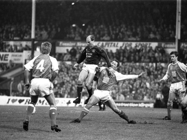 Hearts' Eamonn Bannon beats Hibs' Gordon Rae in the traditional New Year's Day Hearts v Hibs Edinburgh derby football match played at Tynecastle in January 1990. Final score 2-0 to Hearts.