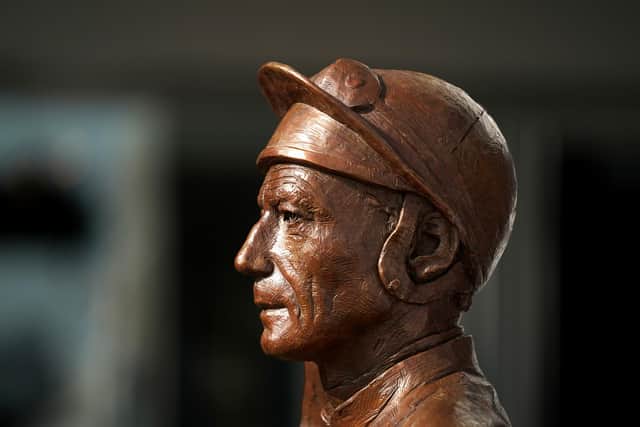 Lester Piggott statue at Epsom Racecourse.
