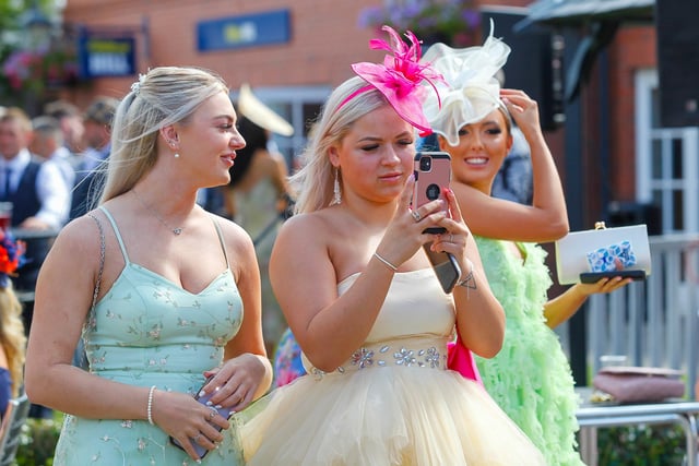 Guests were seen taking plenty of pictures as they arrived for a day at the races.