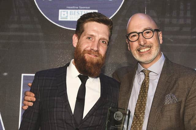 Callum Hain of Akva in Fountainbridge, left, is handed the Best Family Friendly title by Victor Contini at the last Edinburgh Evening News Restaurant Awards ceremony held in 2019. Picture: Neil Hanna