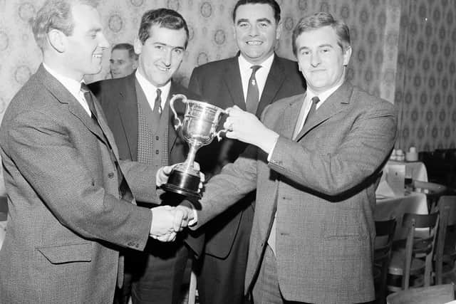 Renton Laidlaw, left, presents a trophy during his spell as the Edinburgh Evening News golf writer.