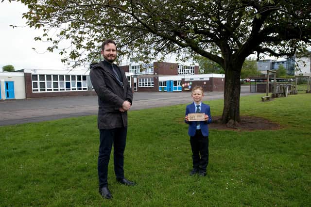 Acting Depute Head Teacher at Oxgang Primary School Graham Bowman with competition winner Dylan Campbell.