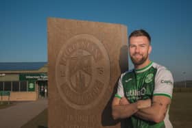 Mikey Devlin has signed a deal with Hibs until the end of the season