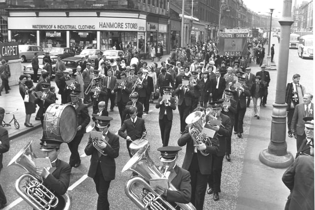 A brass band marching down Leith Walk, en route to Leith Links, celebrating the Scottish Miners' Gala Day in June 1966.
