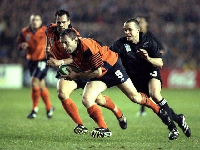 Gary Armstrong of Scotland can be seen here being chased down by Christian Cullen of New Zealand during the Rugby World Cup match played at Murrayfield in Edinburgh, on 24 October 1999.