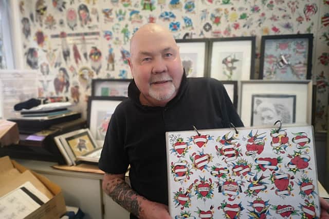 Bill with some of his designs