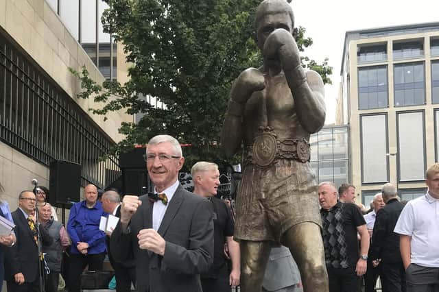 The Scottish legend stands beside his statue which was unveiled today.