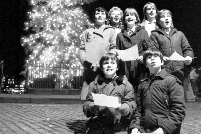 Carrick Knowe Primary School pupils singing carols as the Mound's Christmas tree lights were switched on in December 1984.