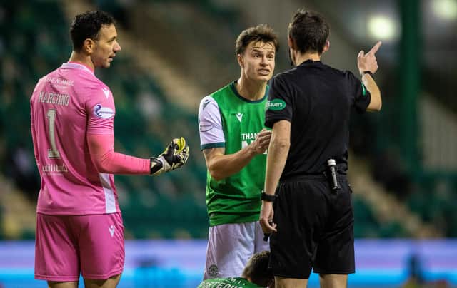 Ofir Marciano and Melker Hallberg have word with referee Kevin Clancy after Alfredo Morelos appeared to stamp on Ryan Porteous
