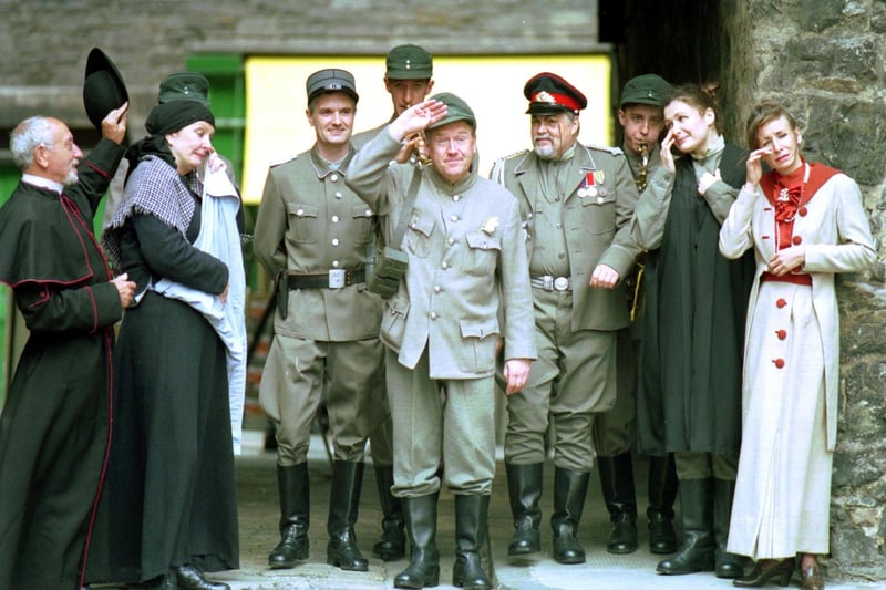 The Borderline theatre company with Andy Cameron (saluting) as the eponymous Guid Sodjer Schweik - adapted from the novel Good Soldier Schweik - playing at Moray House during Edinburgh Festival Fringe 1993. Also in picture: Phil McCall (extreme left), Billy Riddoch (monocle), Laurie Venrty (at Andy's elbow).