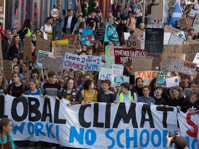 Climate strikers make their way from the Meadows to the Scottish Parliament on the global day of action on September 20, 2019. .